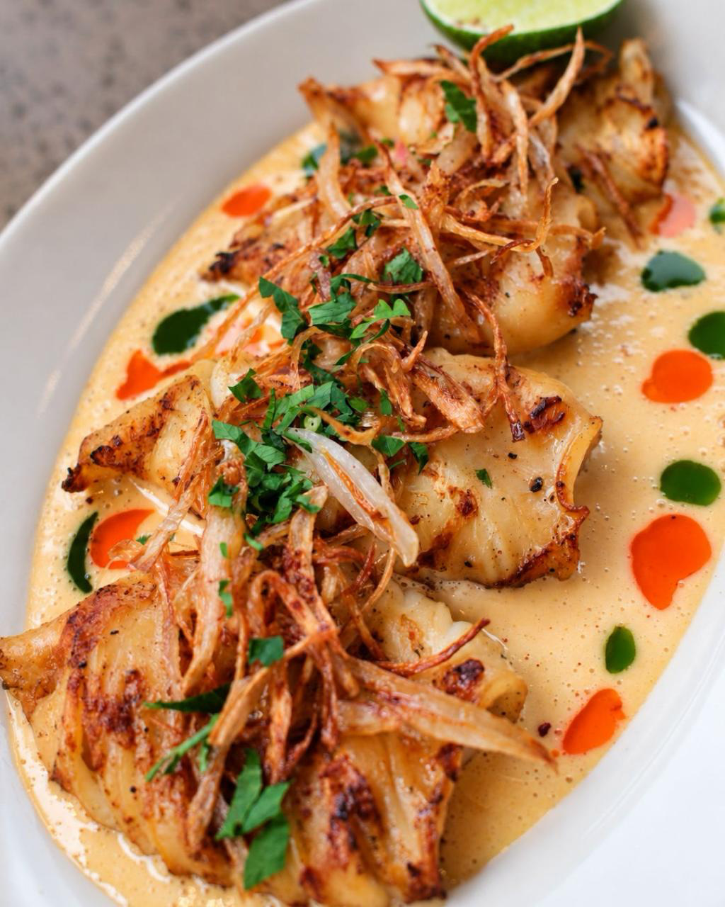 Grilled baby calamari close-up