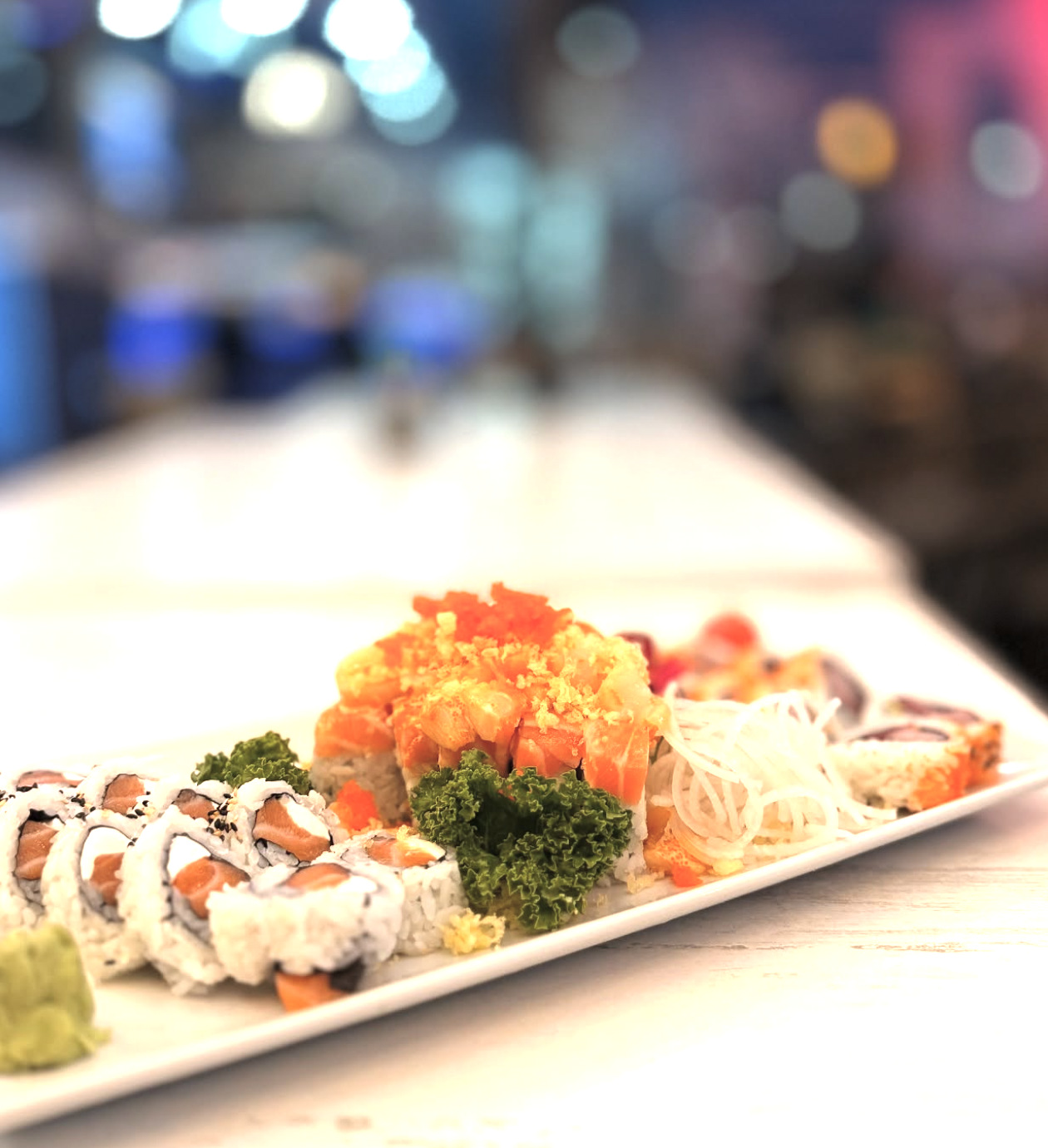 Signature roll platter with a blurred dining room behind